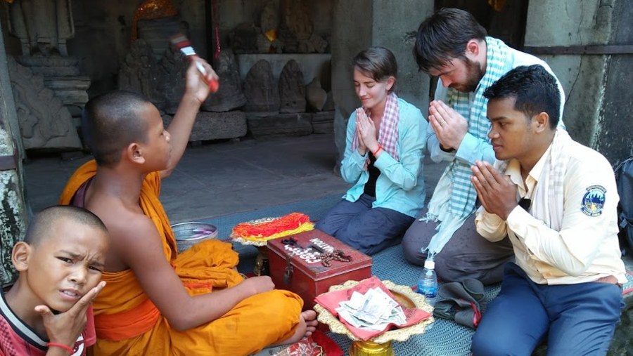 Receiving a blessing at Angkor Wat