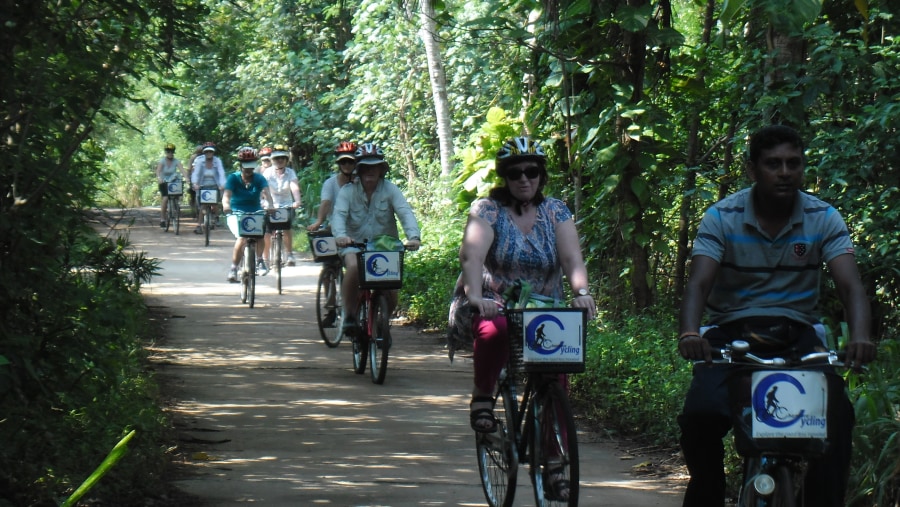 Tourists cycling near the local village.