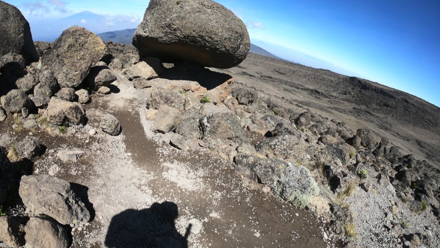 Mt Kilimanjaro well balanced rock. Mt meru and Shira peak on the back ground.