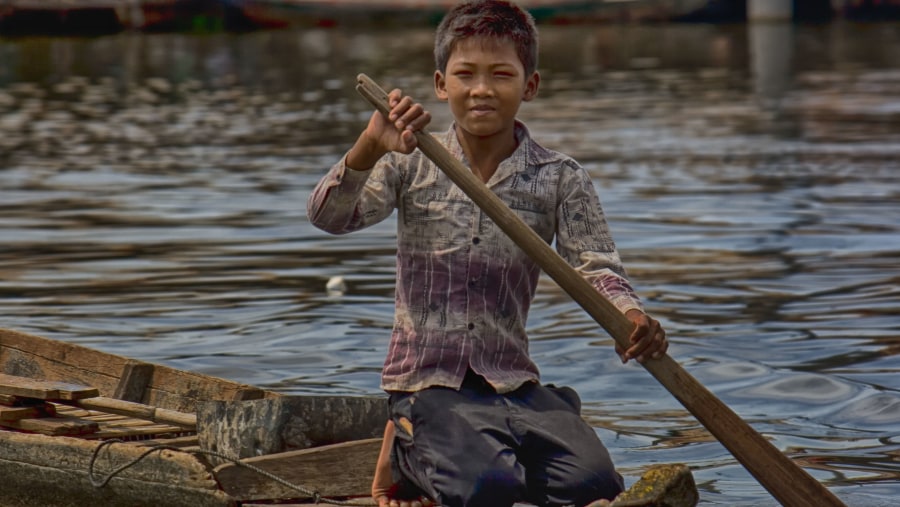 a boy rowing home