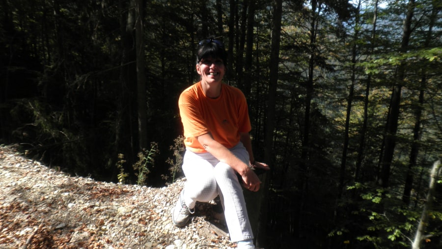 Resting on the stump after walking on the steep terrain