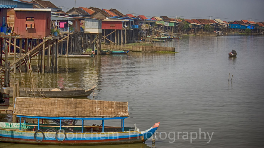 fishermen houses are along the edges of a chanel.