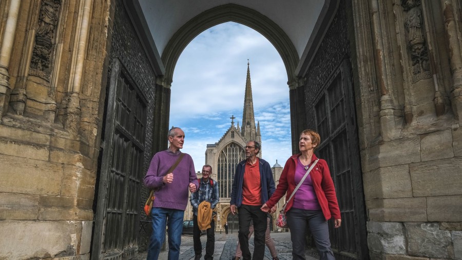 Tour group at the Erpingham Gate, Norwich Cathedral