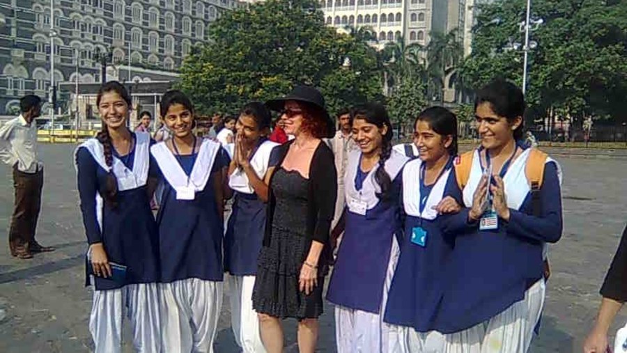 Guest with School girls backdrop of Taj Mahal Hotel & Palace