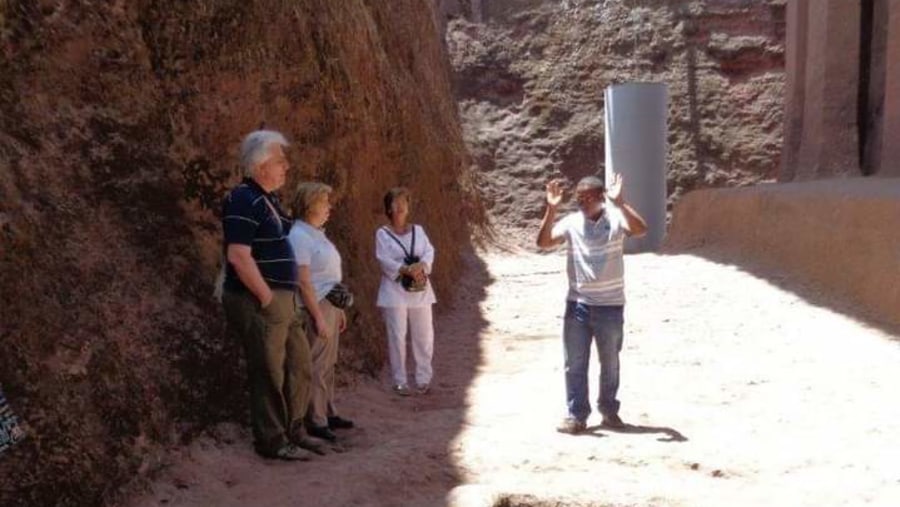 Explaining to my clients about the rock-hewn church of Bete Medhaniyalem, Lalibela 
