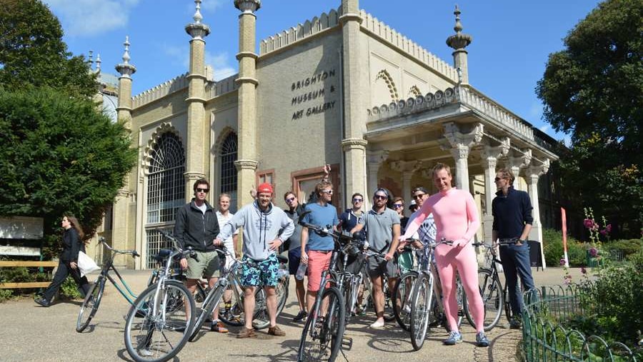 A Stag party on the Brighton Bike Tour have there photo taken infront of the Royal Pavilion Palace
