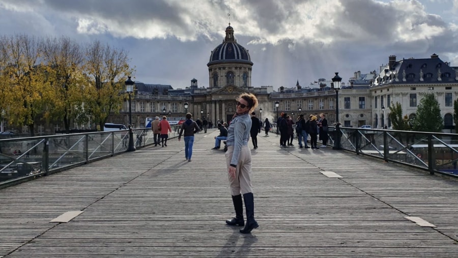 Crossing the love bridge with the imposing French Academy on the background