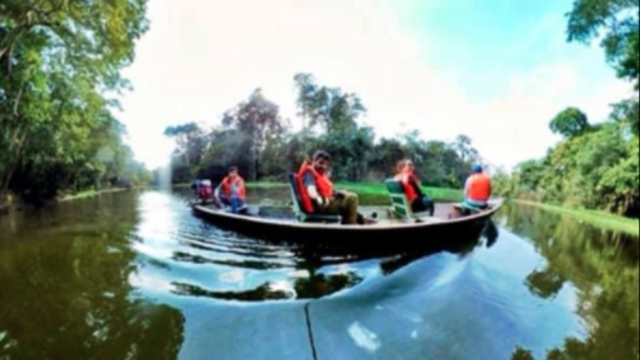 Canoeing around a black water lake