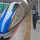 Thumbnail: The front of a bullet train at a train station in Japan. The train has a blue nose and white sides.