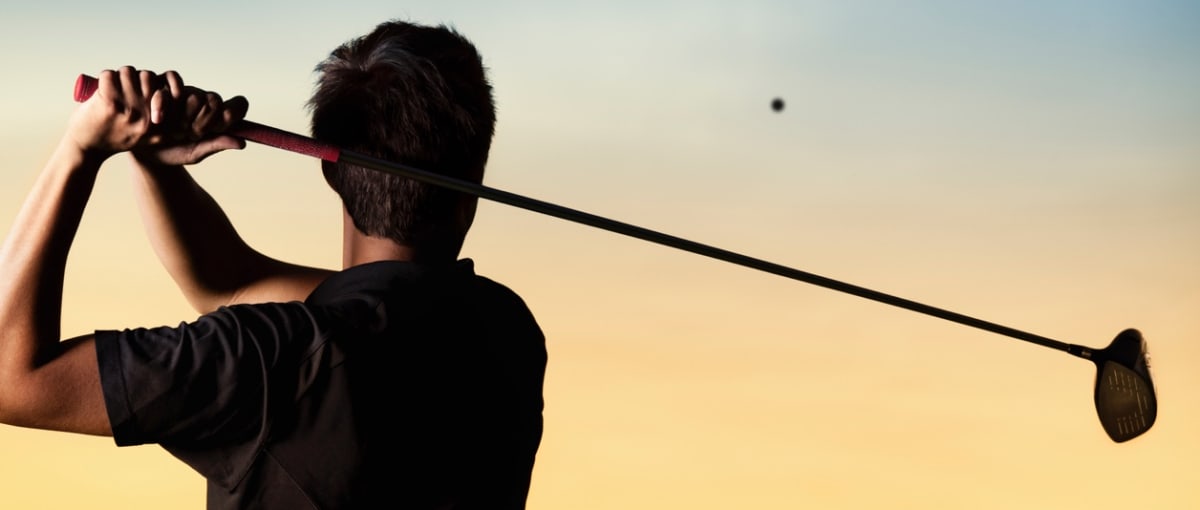 man-golfing-night