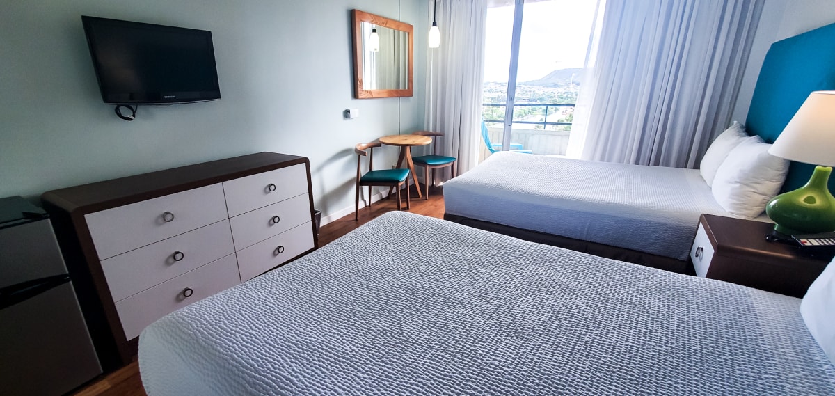 Elevated Corner City View with Two Double Beds