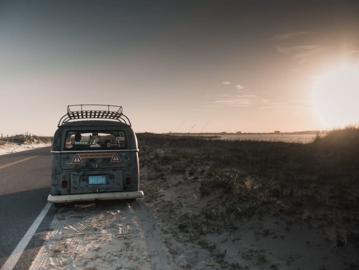 The rear of a Volkswagen Van on the side of the road