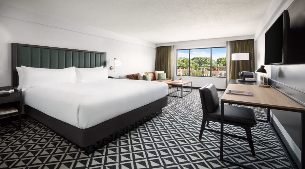 Stay productive with free high speed Wi-Fi access and a well-lit desk with an ergonomic chair. You can unwind on the King size bed while you watch your favorite shows on a 49-in TV. This room has a number of home comforts such as a Keurig, dual-line phone with voicemail and triple-sheeted bed.