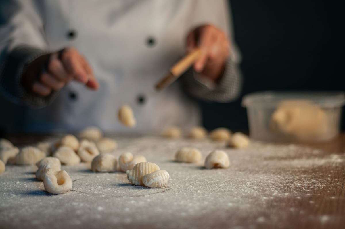 person handmaking gnocchi
