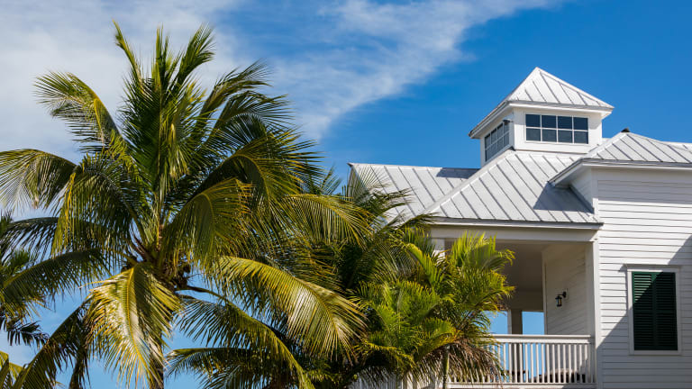 Marker Building on the right and coconut trees on the left of the image.