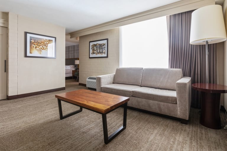 couch with coffee table and side table with lamp