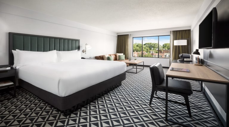 Relax in one of our spacious Tower King rooms facing historic Beacon or St. Paul street. Stay productive with free high speed Wi-Fi access and a well-lit desk with an ergonomic chair. You can unwind on the King size bed while you watch your favorite shows on a 49-inch TV