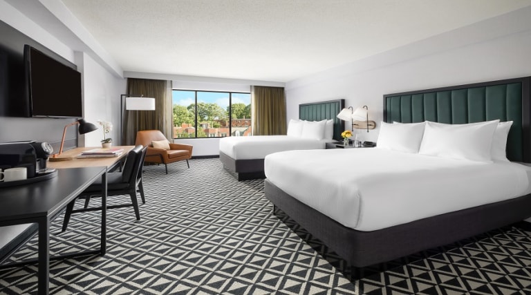Our spacious Tower room comes with two double beds, free high speed Wi-Fi and a dual-line phone with voicemail. Watch the 49-in TV while you kick back and relax on the lounge chair and ottoman. The well-lit desk and ergonomic chair keeps your productivity and at home comforts high.