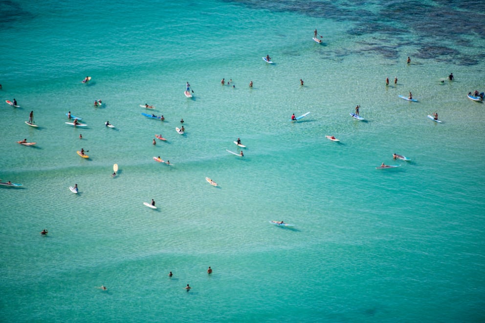 surfers on waikiki beach