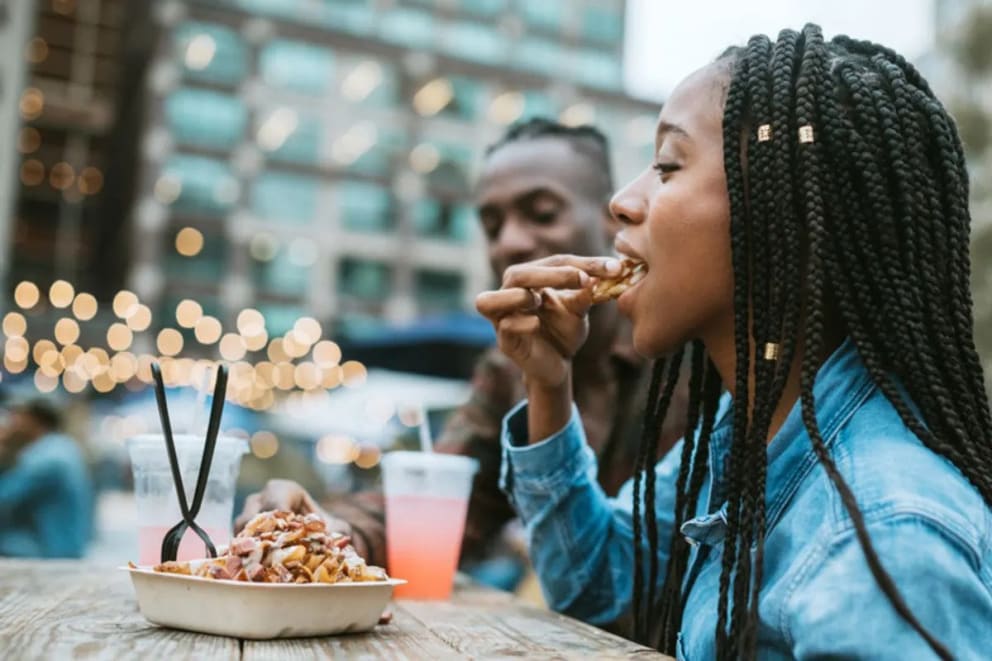 Girl Eating in NYC