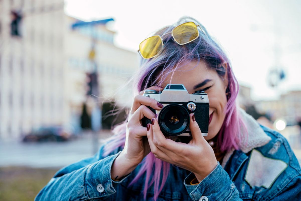 woman-with-purple-hair-taking-photo