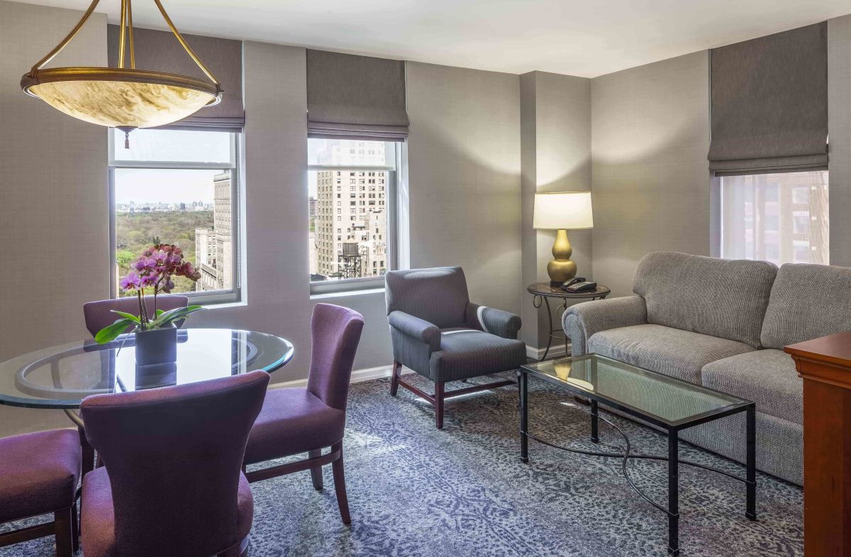 The Manhattan Club, a rooms living room and view of the city from windows