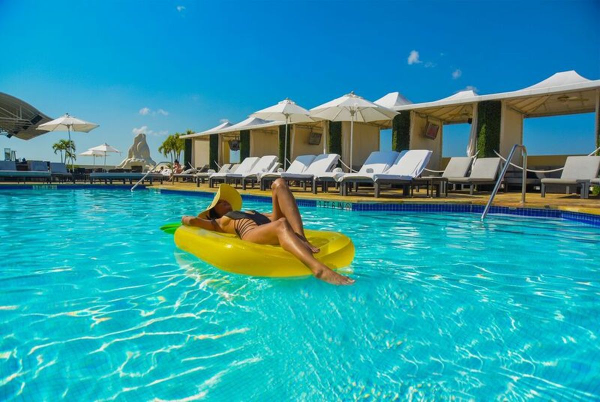 lady floating in pool