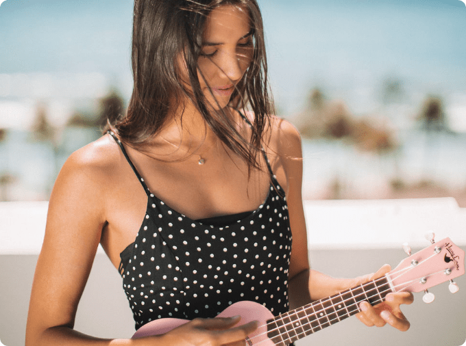 woman playing ukelele