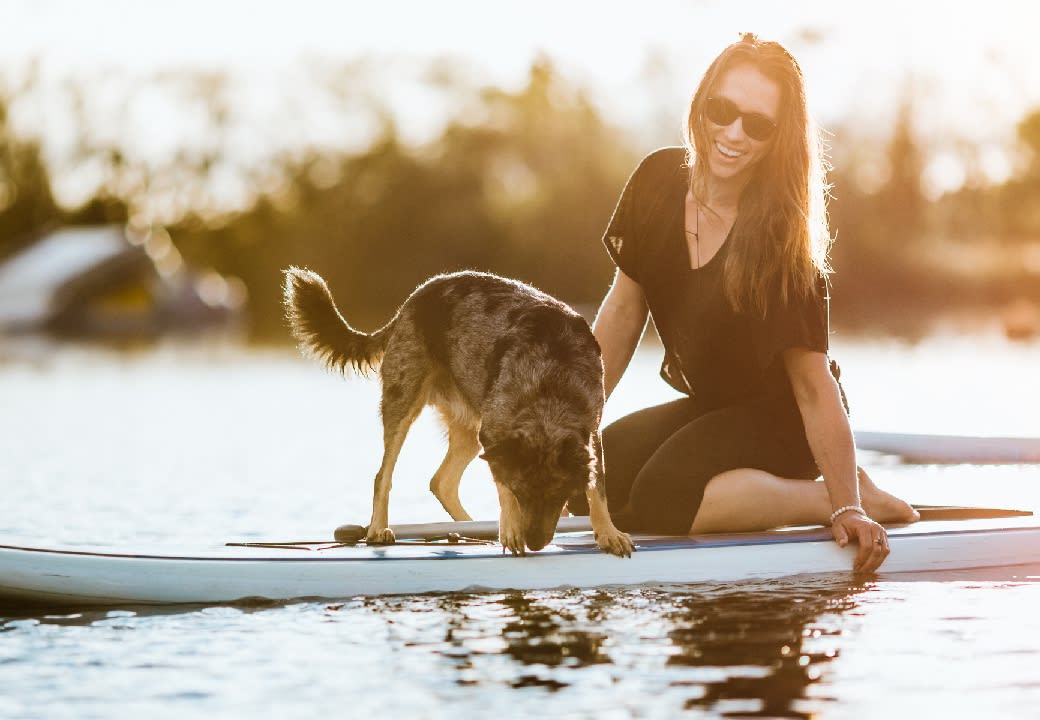 Woman and dog on lake