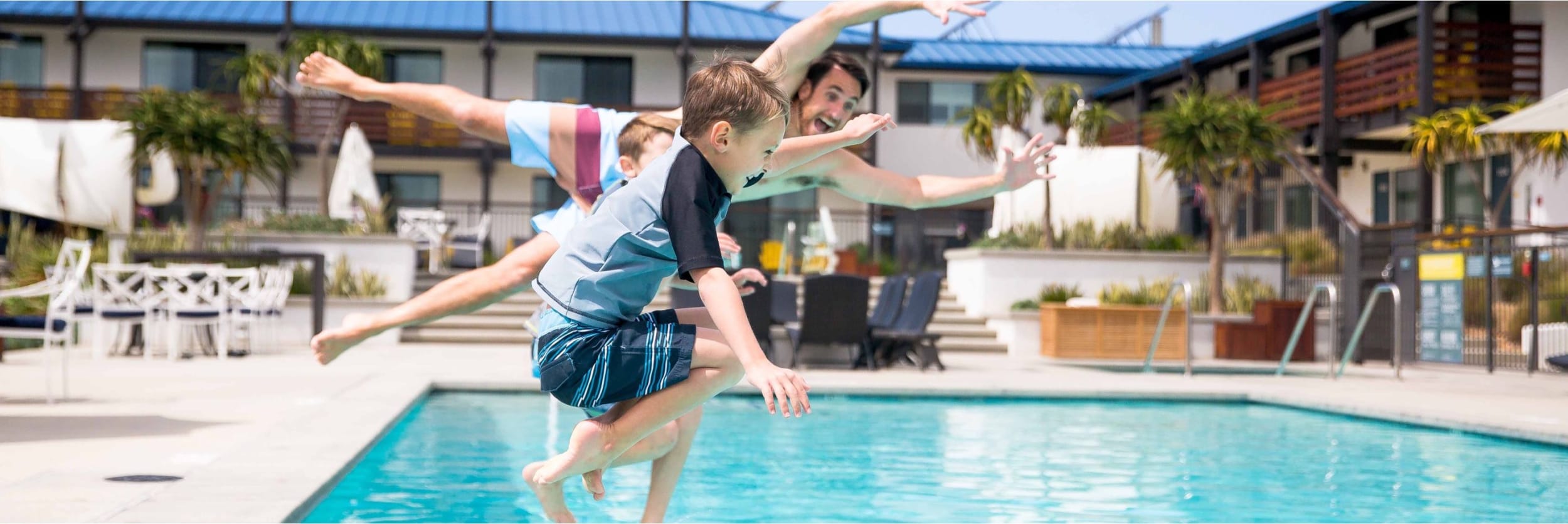 kids jumping in pool