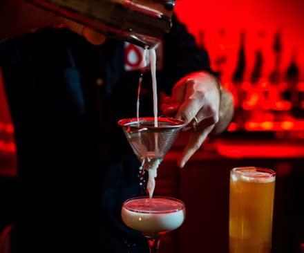 bartender pouring a glass