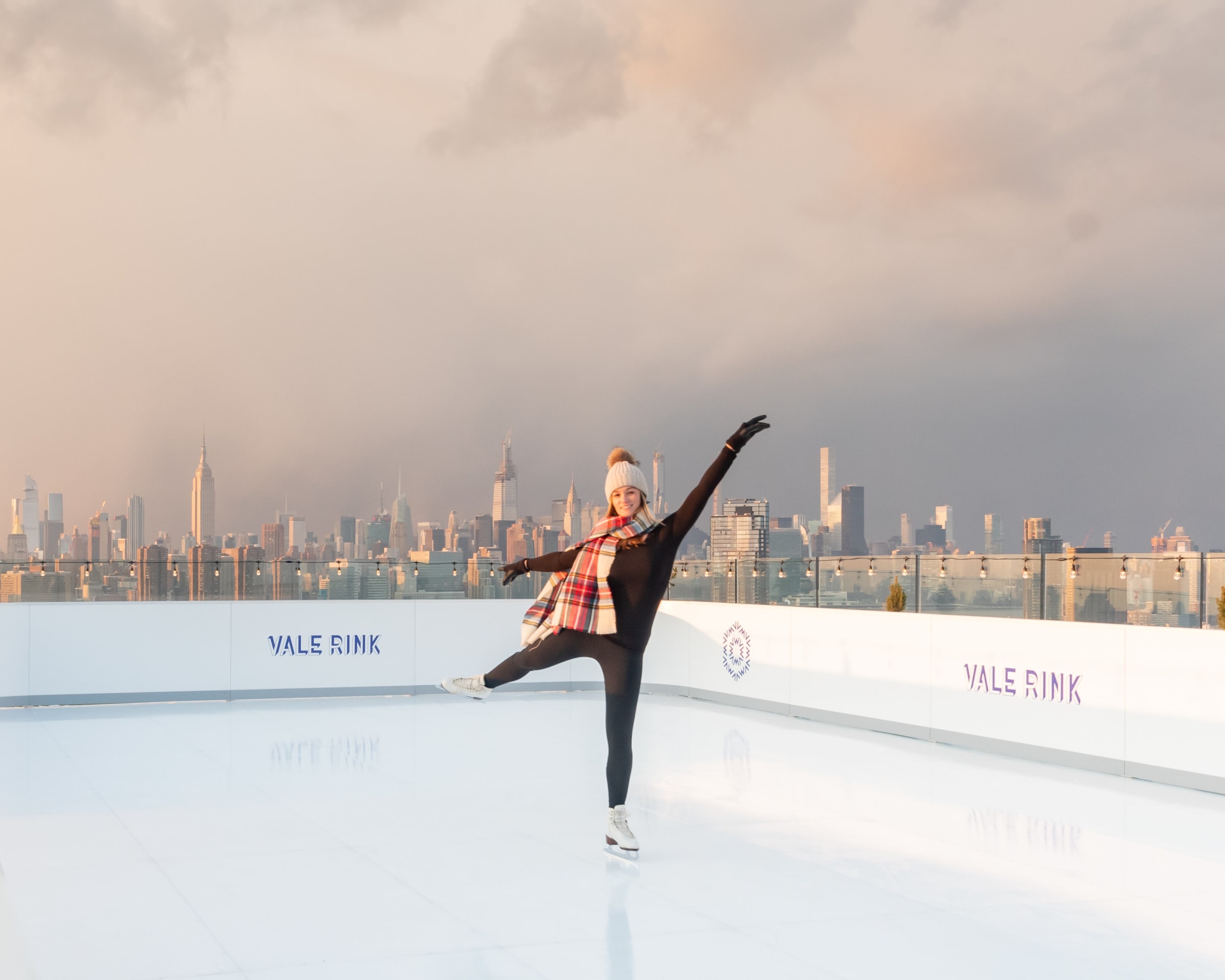 Skate the Skyline. Woman skating in the vale rink. Image