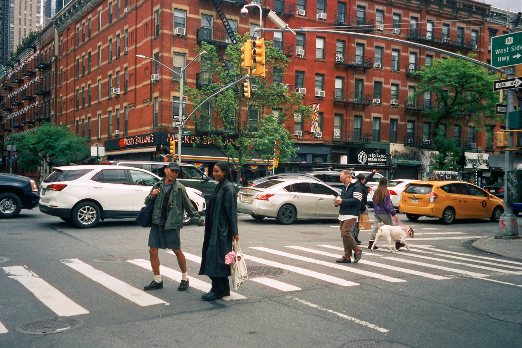 People walking across the street with dogs - Hells Kitchen