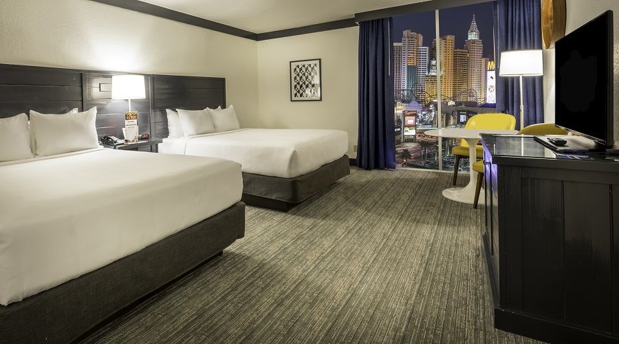 Two Queen beds next to window with Strip view