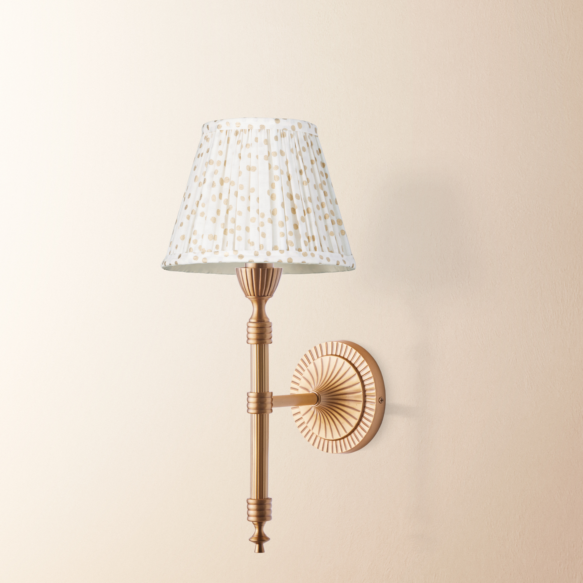 Wrappling wall fixture in antiqued brass