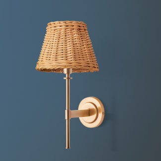 Tremmers wall fixture in antiqued brass