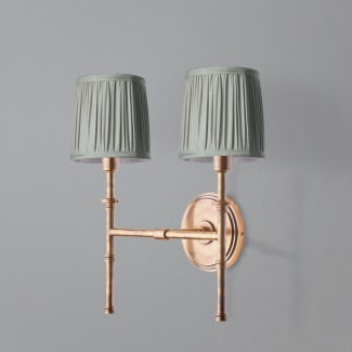 Double Chukka Wall fixture in antiqued brass