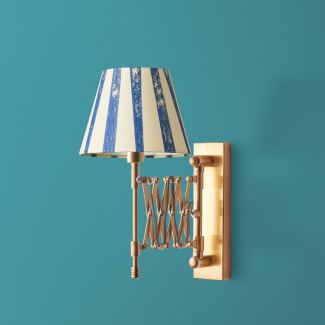 Tina wall fixture in antique brass