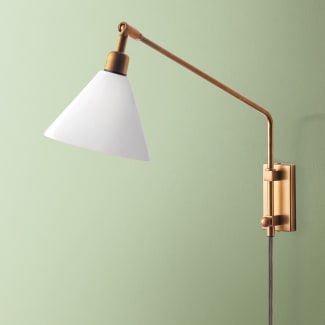 Carter Wall fixture in antiqued Brass