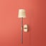 Besidem wall fixture in antiqued brass