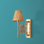Tina wall fixture in antique brass