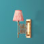 Tina wall fixture in antique brass