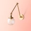 Stork wall fixture in antiqued brass