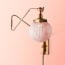 Cooper Wall fixture in antiqued Brass