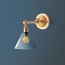 Double jointed wall fixture in antiqued brass