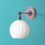 Elbow wall fixture in bronze