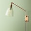 Carter Wall fixture in antiqued Brass