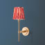 Tremmers wall fixture in antiqued brass