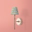Larger Single chukka wall fixture in antiqued brass
