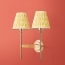 Double Tremmers wall fixture in antiqued brass